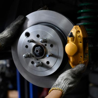 Auto,Mechanic,Installing,Two,Piston,Brake,Calipers,And,Disc,Brake