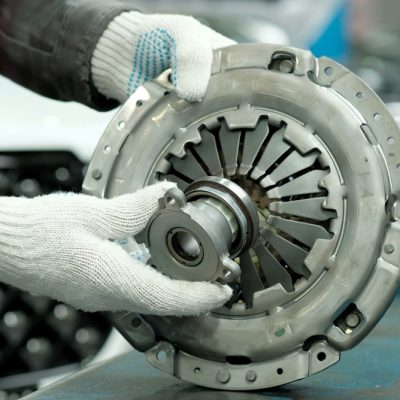 Auto,Parts.,Clutch,Kit,Close-up.,An,Auto,Mechanic,Checks,The
