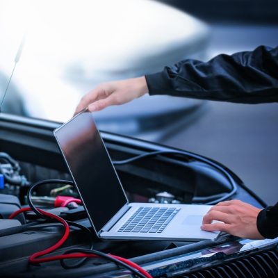 Car,Diagnostic,Service,Close,Up,Computer,And,Modern,Mechanic,In