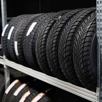 New,Car,Tires,On,Rack,In,Auto,Store
